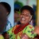 A Fijian woman smiling while wearing leaves and small blossoms behind her ears